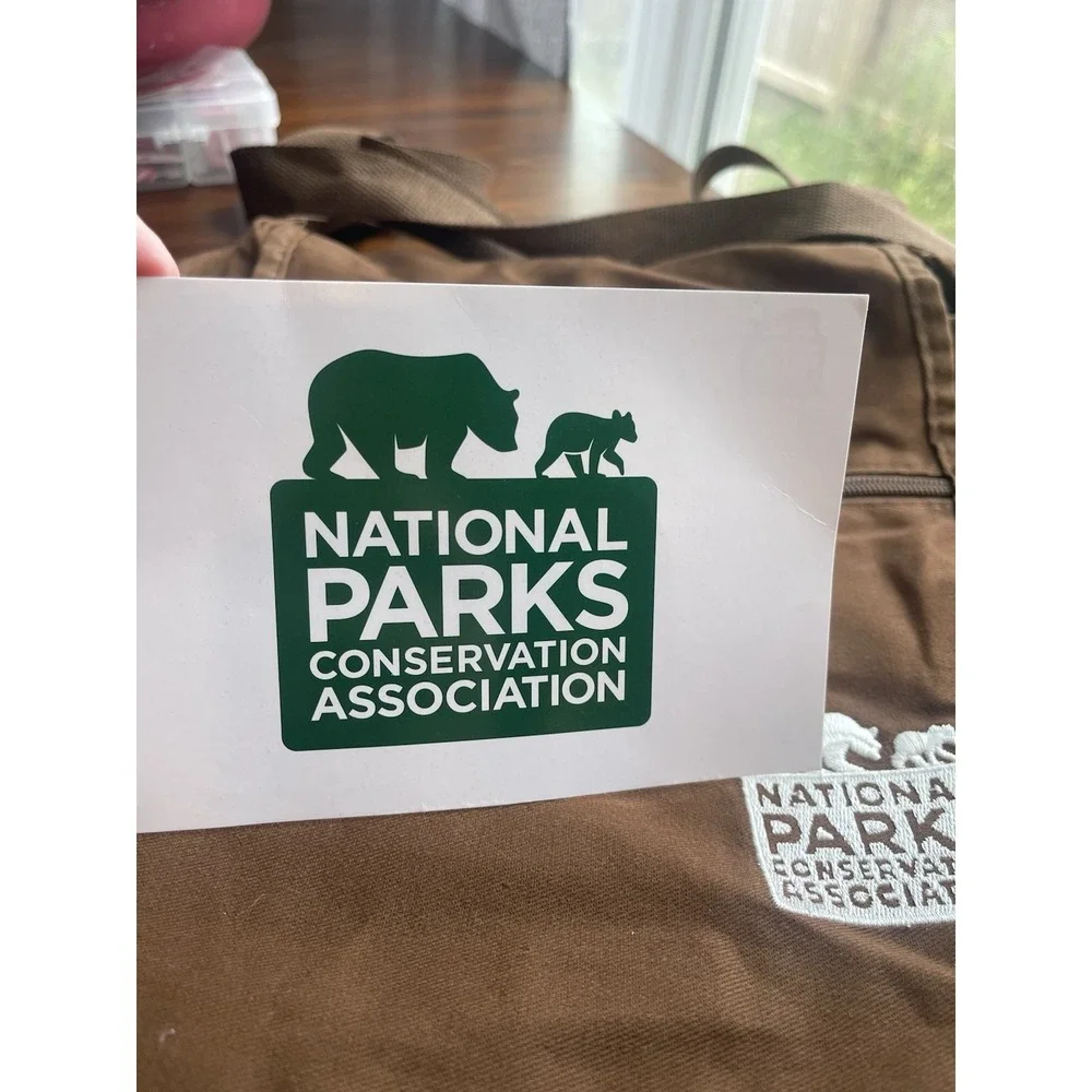 Shoulder bag National‎ Parks Conservation Assoc logo; 4 pockets, cover flap